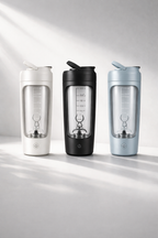 Three portable drink mixers in white, black, and blue on a light gray background