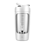 White and silver shaker bottle with measurement markings on a white background